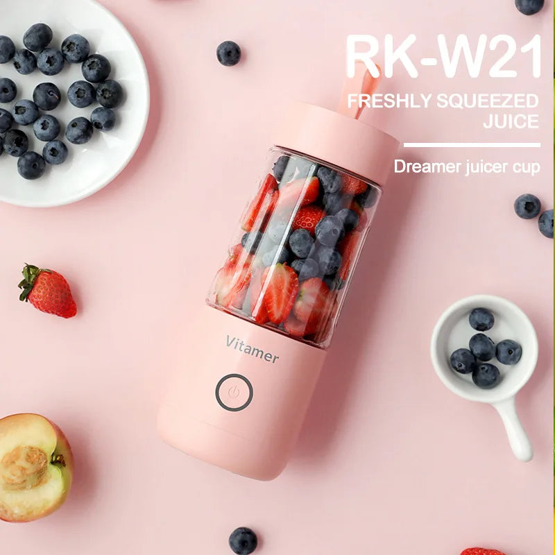 Compact personal blender next to fruit